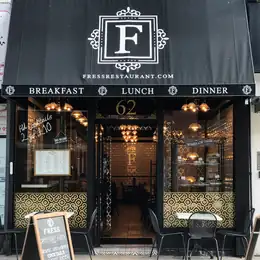 The gilt F above the door at Fress